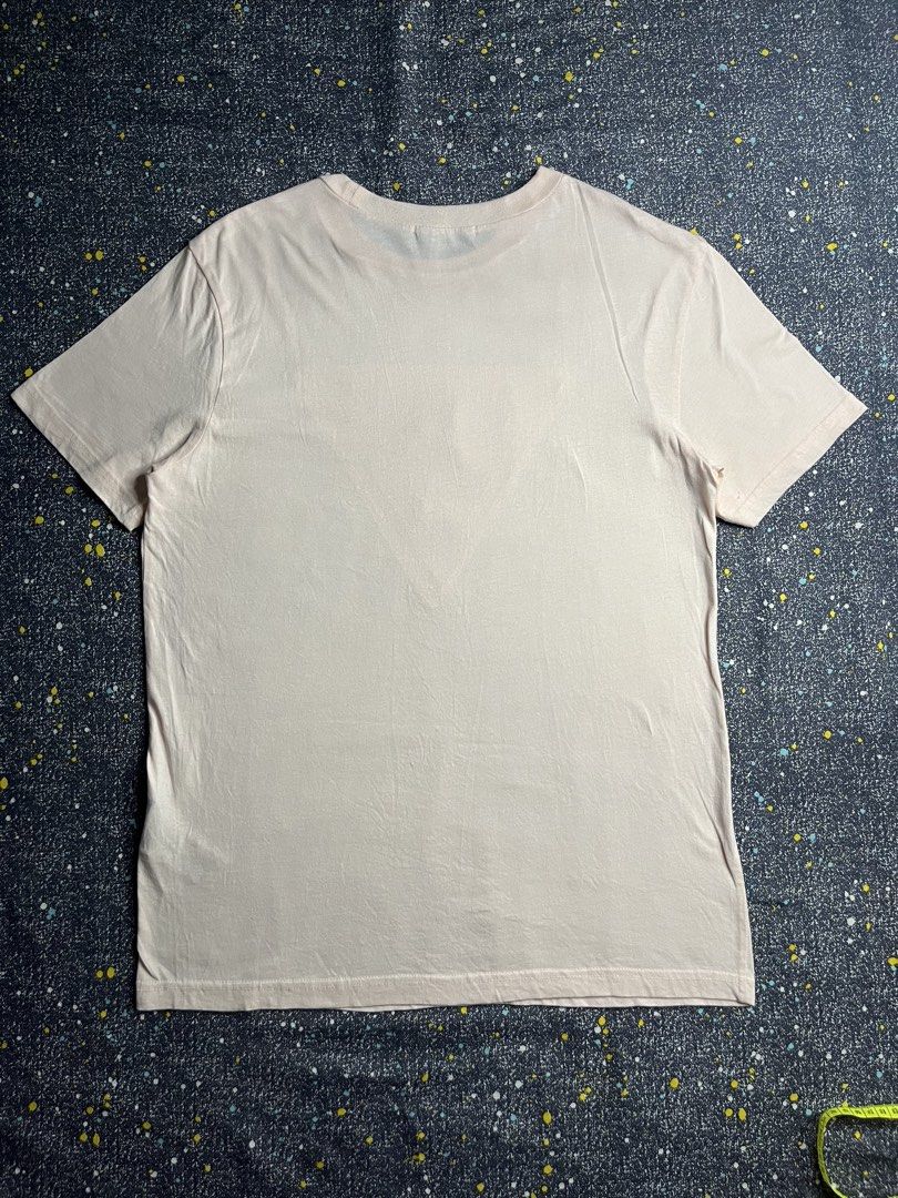 Guess Embossed Logo Crew Neck T-Shirt Pink Medium (Category: Shirts) located in Manila. Submitted by lj_thrifter (Listing ID 1469168739, Image 2). Description: - Brand: Guess - Color: Pale Pink - Size: M - Color rate 9.5/10 - No issue - Material: 100% Cotton (Made in Korea) - Fit: Standard fit - Design: Classic crew neck with tonal embossed triangular logo on chest - Style: Clean design, ideal for everyday casual wear.