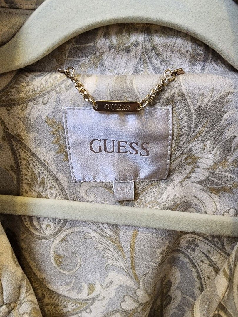 Guess Trench Coat Brandnew (Category: Coats, Jackets and Outerwear) located in Quezon City. Submitted by pinkyshang (Listing ID 1469235292, Image 3). Description: - Brand: Guess Vilma Suede Trench Coat - Size: Medium - Colorway: Beige and Grey with all-over Paisley Print - Closure: Double-breasted front with Gold-Toned logo buttons - Accessories: Includes matching waist belt - Details: Structured Collar and Lapels, with interior hanging chain tag
