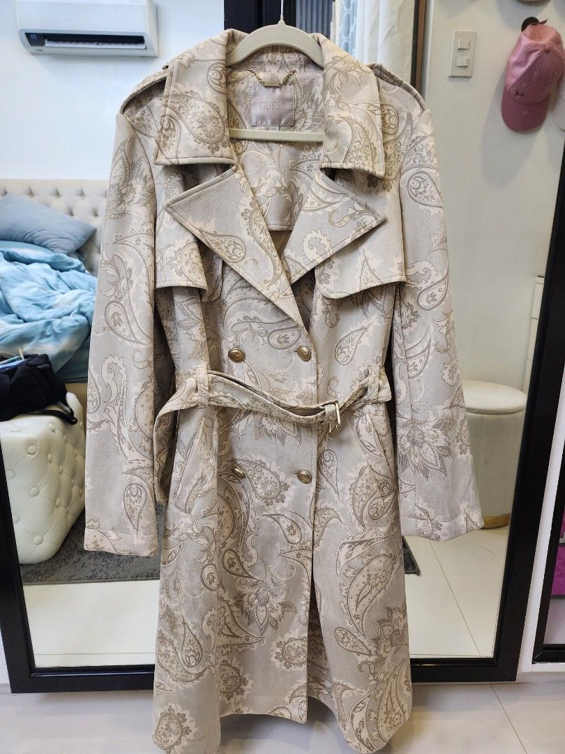 Guess Trench Coat Brandnew (Category: Coats, Jackets and Outerwear) located in Quezon City. Submitted by pinkyshang (Listing ID 1469235292, Image 1). Description: - Brand: Guess Vilma Suede Trench Coat - Size: Medium - Colorway: Beige and Grey with all-over Paisley Print - Closure: Double-breasted front with Gold-Toned logo buttons - Accessories: Includes matching waist belt - Details: Structured Collar and Lapels, with interior hanging chain tag