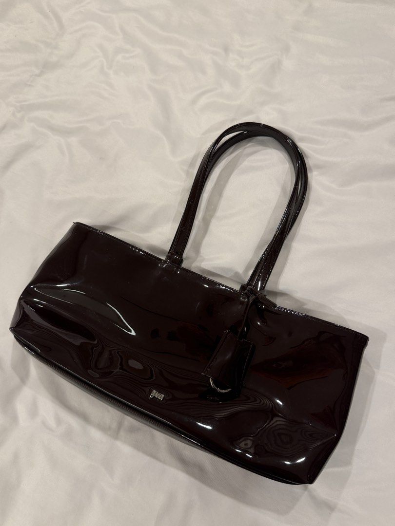 GVN Holiday Bag (Category: Shoulder Bags) located in Quezon City. Submitted by goldenfinds.ph (Listing ID 1469319306, Image 1). Description: GVN holiday bag in Oxblood Patent material, burgundy color Suede inner Retail price - around ₱2.6k With dust bag Never been used, only stored RFS: not my style Negotiable for sure buyer Can pick up in QC / Makati or meet up in Greenbelt.