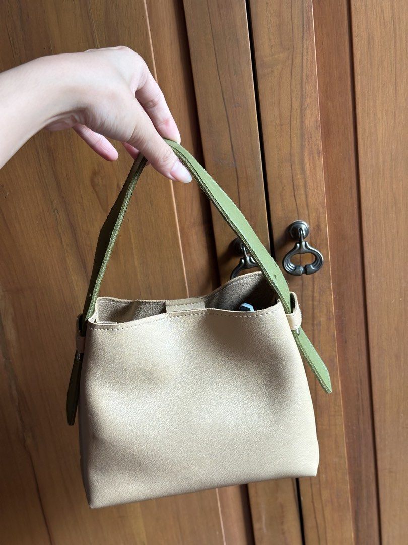 gvn micro bag (beige) (Category: Cross-body Bags) located in Makati City. Submitted by coconutbread (Listing ID 1469220755, Image 2). Description: - beige base - with interchangeable orange & green top handles - with interchangeable blue & light green straps - slight discolouration on the base (see last pic).