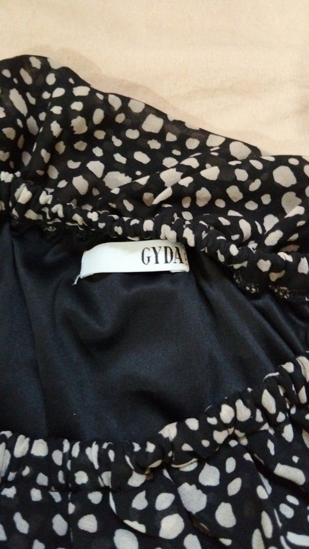 GYDA Black and White Dot Jumpsuit (Category: Jumpsuits) located in Tacloban City. Submitted by thead.declutters (Listing ID 1469216018, Image 2). Description: - Brand: GYDA - Design: Chic black & white dotted pattern with a ruffled neckline - Fit & Comfort: Lightweight material, fully lined, elastic waistband, and easy pull-on style - Features: Short flutter sleeves and trendy wide-legged pants - Perfect for: Casual outings, dates, or warm weathe