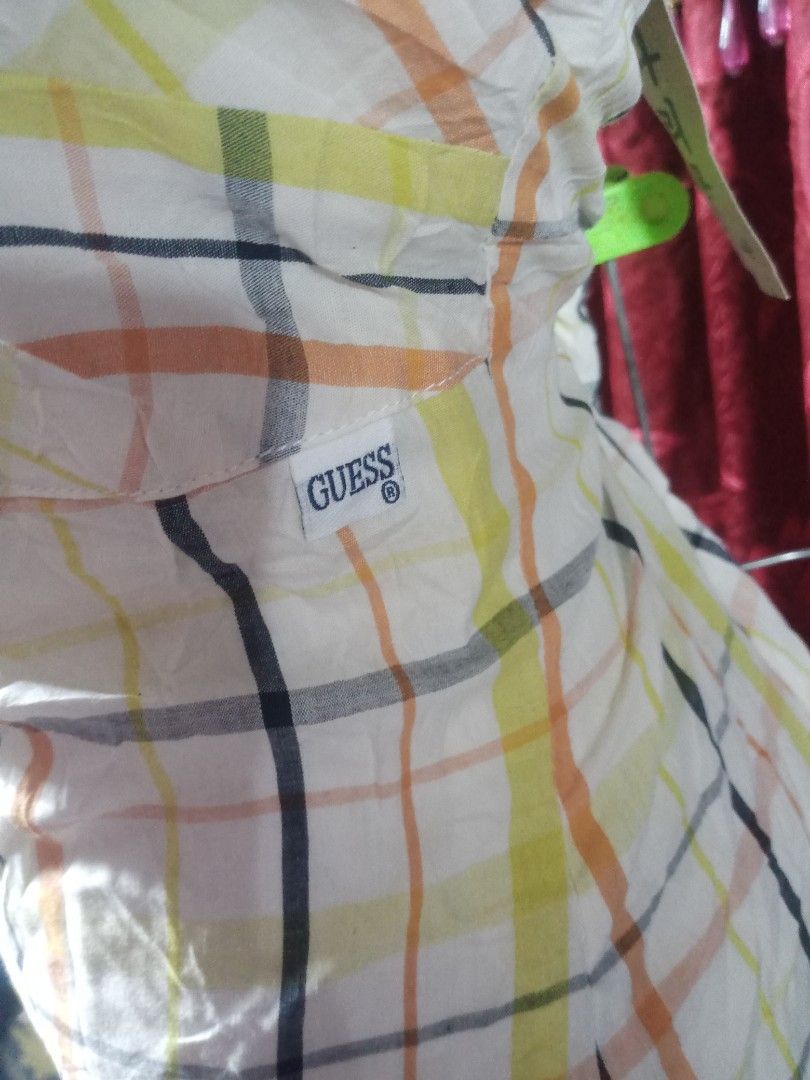 Halter midi dress (Category: Dresses) located in Manila. Submitted by wheneity67thifted (Listing ID 1469268373, Image 3). Description: This is a sleeveless, halter-neck midi dress featuring a cream-colored fabric with a yellow, orange, and black plaid check pattern..