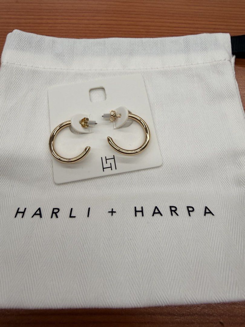 Harli + Harpa Gold Hoop Earrings (Category: Earrings) located in Quezon City. Submitted by ellamenopi (Listing ID 1469182420, Image 2). Description: - Brand: Harli + Harpa - Style: Chunky classic gold hoop earrings with secure post backs - Condition: Brand new with tag attached, never used - Inclusions: Original store card and white dust bag - Perfect for everyday wear or dressing up!.