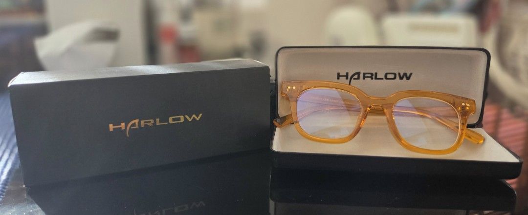 Harlow Glasses with Case (Unisex frame) (Category: Sunglasses & Eyewear) located in Pasig City. Submitted by the40yearoldgamer (Listing ID 1469174645, Image 1). Description: *Harlow eyewear in transparent glossy orange color frame. Medium sized square frame. Includes original branded hard case for protection and storage. Clear lenses installed. Ready for daily wear or prescription lens swap. *Kestana clear eyewear in light green glossy transparen