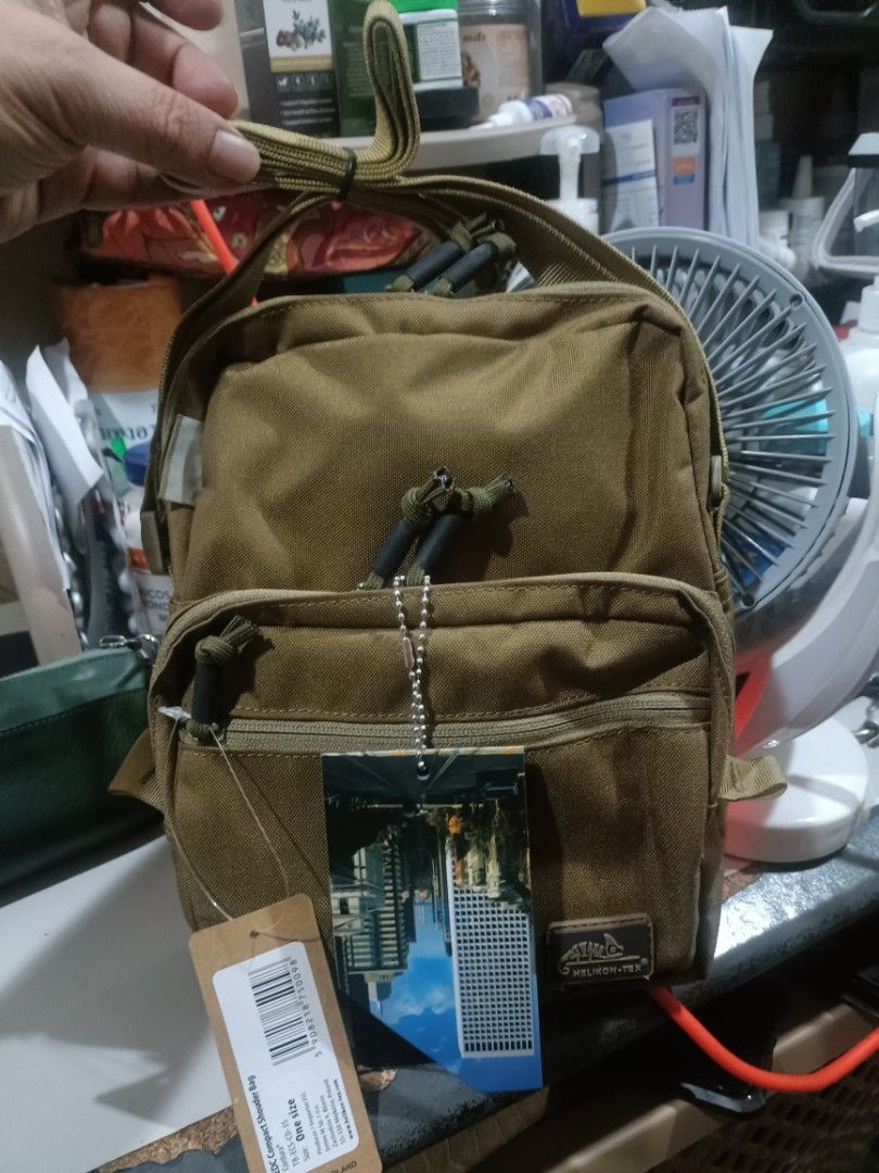 Helikon-Tex EDC Compact Shoulder Bag (Category: Sling Bags) located in Cebu City. Submitted by dediosmark83726 (Listing ID 1469315172, Image 1). Description: - Brand: Helikon-Tex EDC Compact Shoulder Bag - Color: Coyote Brown - Condition: Brand new with original tags attached - Material: Durable 100% nylon main fabric - Compartments: Zippered main compartment with quilted interior lining and secondary front zip pocket - Strap: Adjustable strap bu