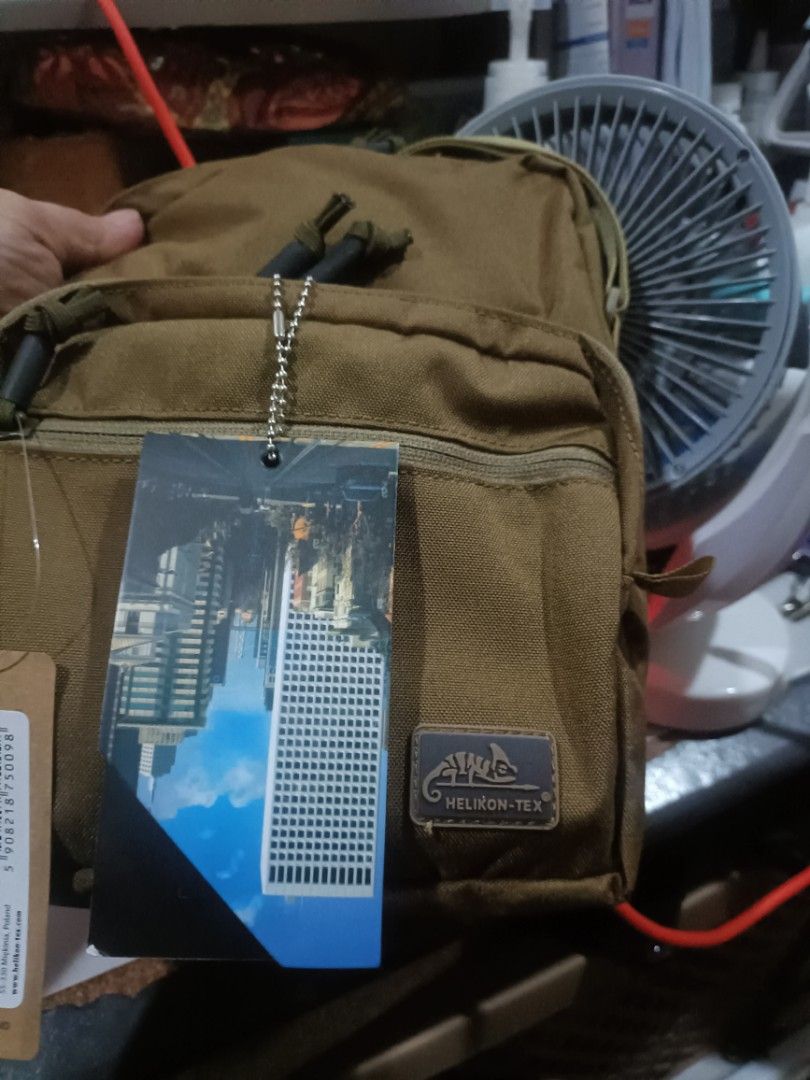 Helikon-Tex EDC Compact Shoulder Bag (Category: Sling Bags) located in Cebu City. Submitted by dediosmark83726 (Listing ID 1469315172, Image 2). Description: - Brand: Helikon-Tex EDC Compact Shoulder Bag - Color: Coyote Brown - Condition: Brand new with original tags attached - Material: Durable 100% nylon main fabric - Compartments: Zippered main compartment with quilted interior lining and secondary front zip pocket - Strap: Adjustable strap bu