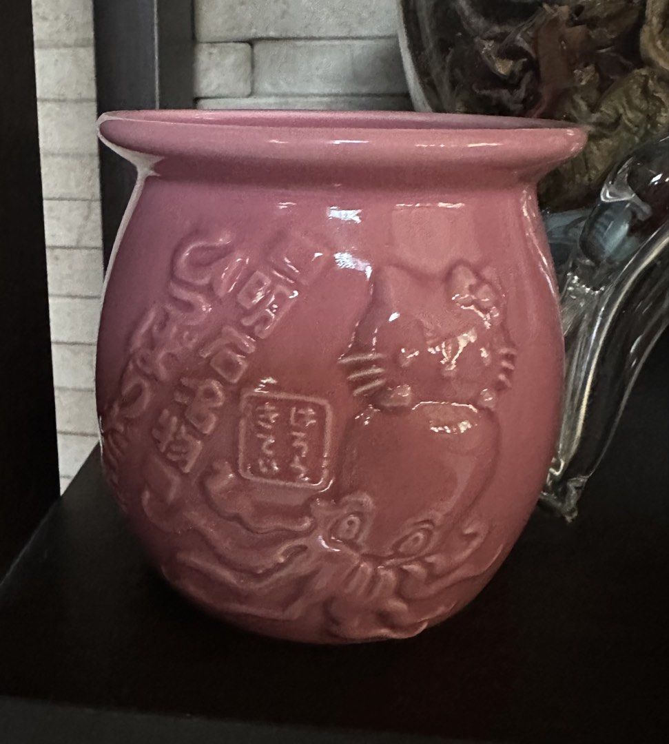 Hello Kitty Akashi Ceramic Pot Octopus Design Pink (Category: Coffee & Tea Tableware) located in Quezon City. Submitted by mitchapple88 (Listing ID 1469217197, Image 1). Description: - Authentic Sanrio collector piece: Pink ceramic pot featuring a raised Kitty and octopus design - Unique details: Embossed Japanese text along the side with a stylish thick flared rim and rounded shape - Versatile use: Perfect as a cute small planter or a trendy des