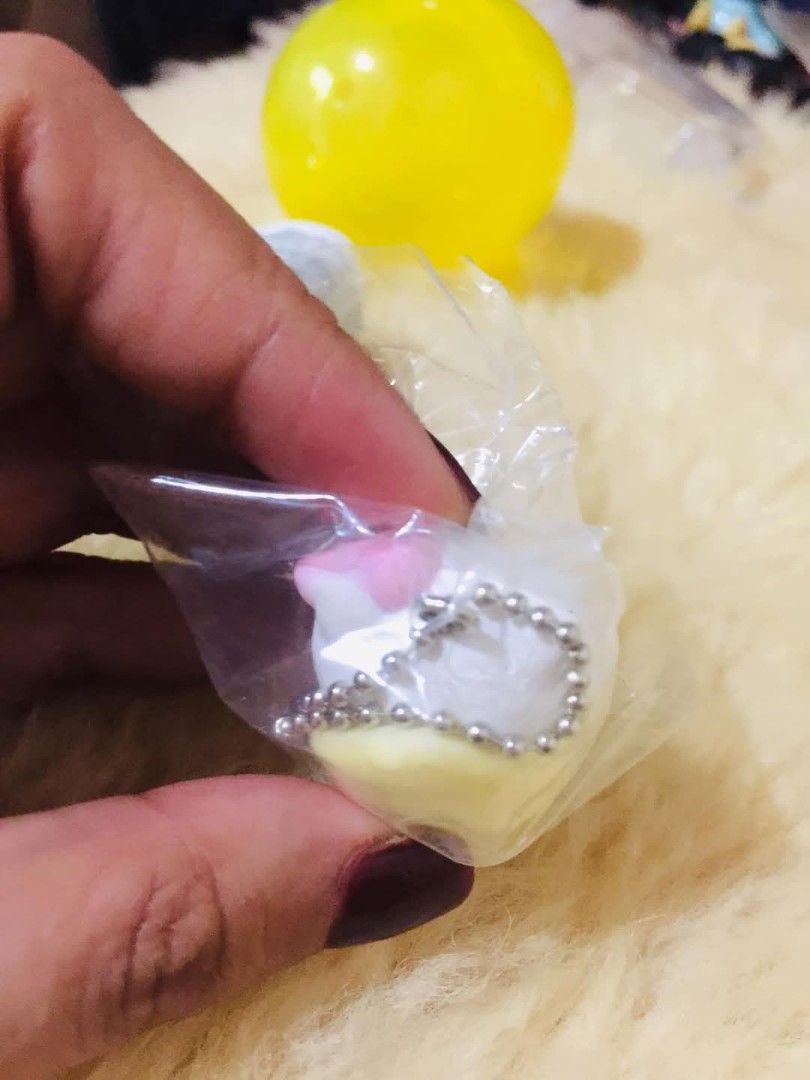 Hello Kitty Egg Sleeping Keychain Bag Charm (Category: Character Goods) located in Baguio. Submitted by izza_thrifty (Listing ID 1469167738, Image 3). Description: - Authentic Sanrio Kitty keychain figure - Adorable design: Kitty sleeping inside a fuzzy yellow egg shell with a pink bow - Soft texture exterior on the egg - Includes a small metal ball chain for easy attachment to bags, keys, or lanyards - Brand new, sealed in original clear plastic