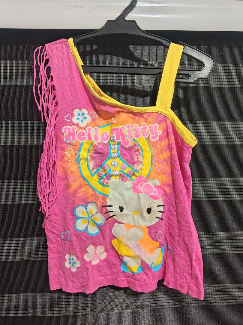 Hello kitty Fringe Tank top (Category: Blouses) located in Tarlac. Submitted by yohfinds (Listing ID 1469318884, Image 1). Description: has some major flaws. (check photos holes) offer price cz idk how to price this one..