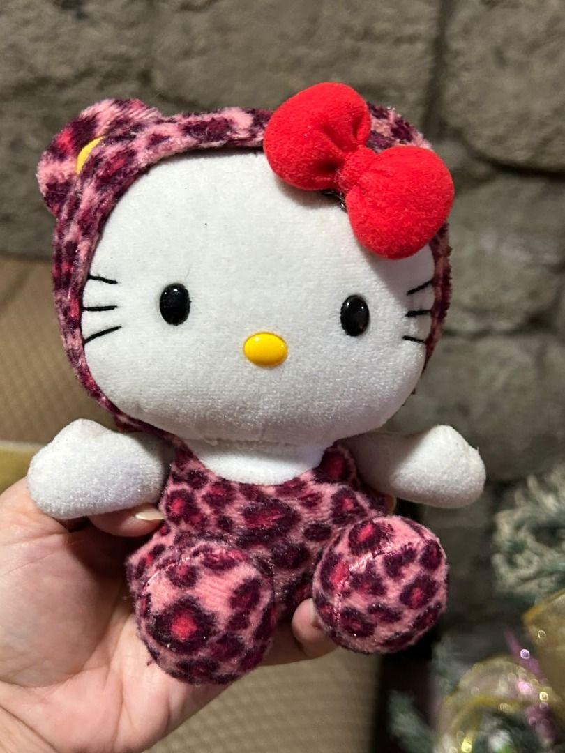 Hello Kitty in the Jungle Plush Tag (Category: Plushies & Soft Toys) located in Las Pinas. Submitted by whatzupriley (Listing ID 1469288384, Image 1). Description: - Authentic Sanrio Kitty plush toy from the Jungle collection - Features a cute pink and purple animal print plush fabric - Mode of Payment: GCash - Shipping: Via J&T Express .