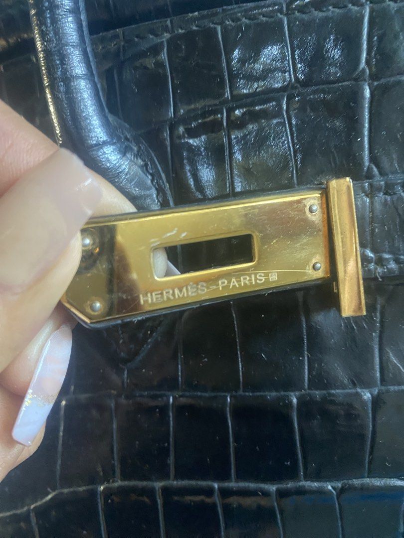 Hermès Birkin Crocodile Black Handbag (Category: Luxury Bags & Wallets) located in Bacolod City. Submitted by chuchaystuffs (Listing ID 1469165607, Image 3). Description: - Authentic Black Crocodile Hermès Birkin bag - Luxurious gold-toned hardware with included closure lock - Classic structured design featuring dual top handles - Stamped Hermès Paris signature on the front plate and hardware - Premium exotic skin body with substantial, rich text
