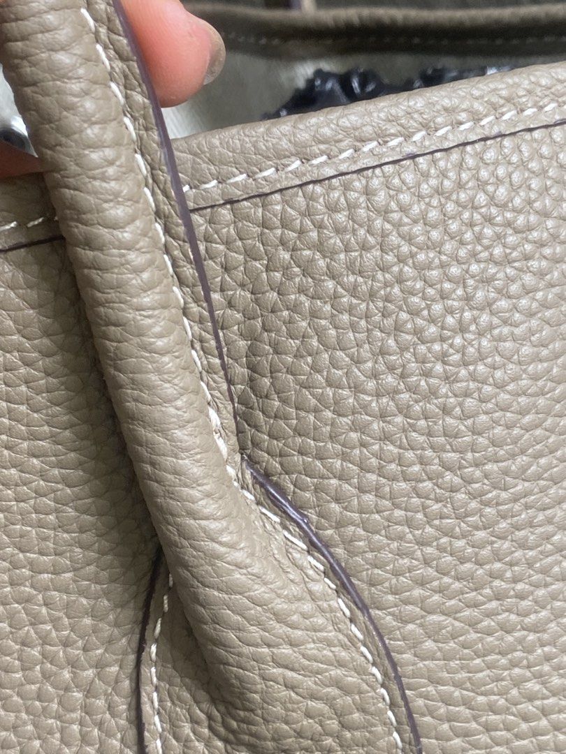 Hermès Etoupe Leather Tote Bag (Category: Tote Bags) located in Bacolod City. Submitted by chuchaystuffs (Listing ID 1469167939, Image 3). Description: - Brand: Hermès - Color: Etoupe with contrast white stitching - Material: Textured pebbled leather - Hardware: Silver-tone - Features: Dual top handles, side snaps, debossed Hermès Paris logo - Interior: Spacious and clean structure - Condition: Great everyday luxury piece.