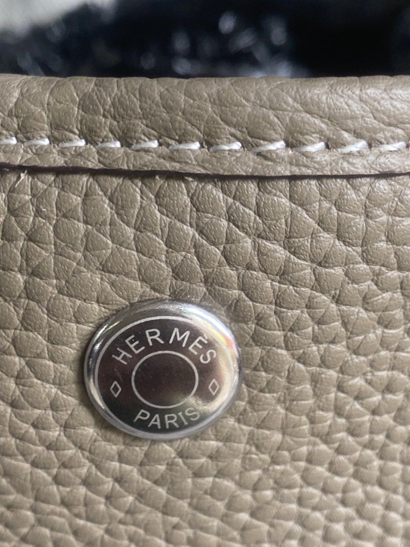 Hermès Etoupe Leather Tote Bag (Category: Tote Bags) located in Bacolod City. Submitted by chuchaystuffs (Listing ID 1469167939, Image 2). Description: - Brand: Hermès - Color: Etoupe with contrast white stitching - Material: Textured pebbled leather - Hardware: Silver-tone - Features: Dual top handles, side snaps, debossed Hermès Paris logo - Interior: Spacious and clean structure - Condition: Great everyday luxury piece.