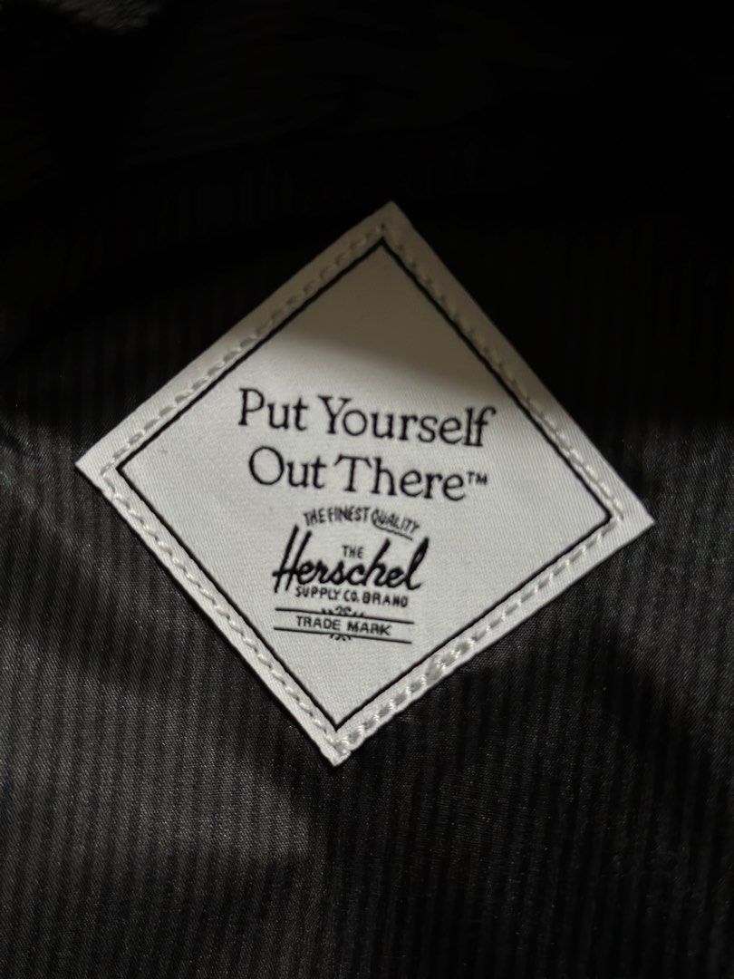 Herschel Supply Co. EcoSystem Recycled Fabric Black Backpack (Category: Luxury Bags & Wallets) located in Baguio. Submitted by annecicat (Listing ID 1469222552, Image 3). Description: - Brand: Herschel Supply Co. - Condition: Brand new with tags attached - Color: Classic black with signature front patch and diamond detail - Material: EcoSystem recycled fabric - Storage: Wide-opening main compartment, front zippered pocket, and inner pocket compar