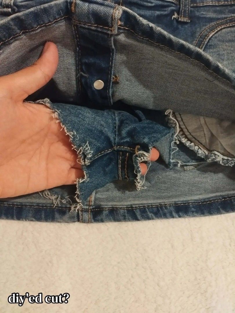 high short Denim Skirt Size 27 a20 (Category: Skirts) located in Carmona. Submitted by ichorvault (Listing ID 1469285334, Image 2). Description: - Item: Denim Skirt - Code: a20 - Size: 27 - Wash: Medium wash denim - Closure & Accents: Button-down front with five metal buttons - Pockets: Front pockets on both sides - Details: Trendy raw, DIY-cut edges on the bottom hem and inner fabric.