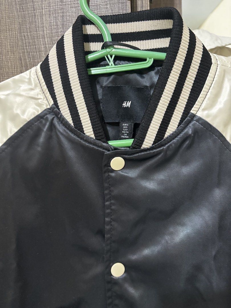 H&M Black and White Varsity Jacket (Category: Coats, Jackets and Outerwear) located in Magalang. Submitted by mvenetri (Listing ID 1469323128, Image 2). Description: H&M Black and White Varsity Jacket - Size S but fits S-Semi L girlies - Snap button closure, striped ribbed collar, cuffs, and hem, plus two front welt pockets - Barely used, like new condition!.