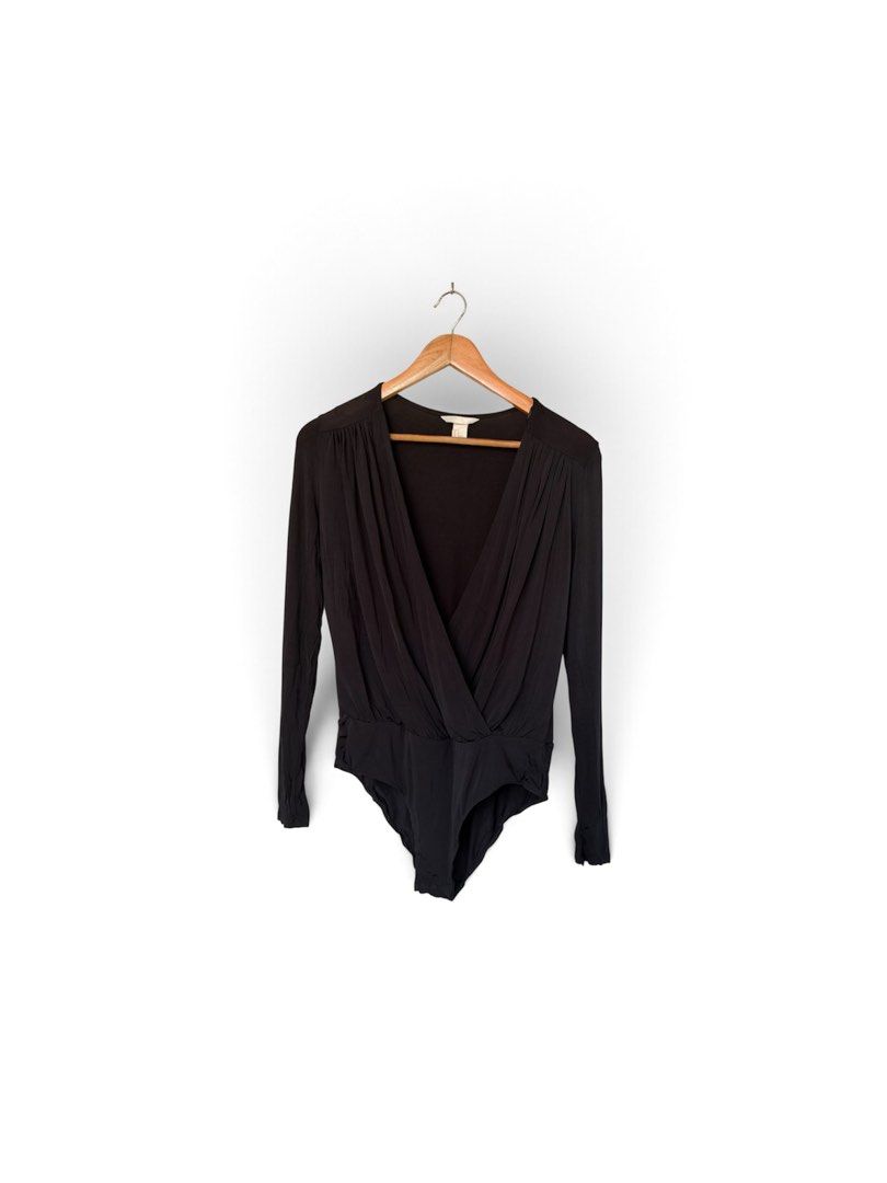H&M Black Long sleeve Bodysuit (Category: Others Tops) located in Quezon City. Submitted by chrizcboutique (Listing ID 1469188659, Image 2). Description: H&M Black Longsleeve bodysuit medium in tag made in Cambodia stretchy material Measurements laid in flat shoulder to shoulder approx 16 inches armpit to armpit approx 19 inches waist approx 17inches Condition still in good condition lightly used no visible flaws please not that the first photo i