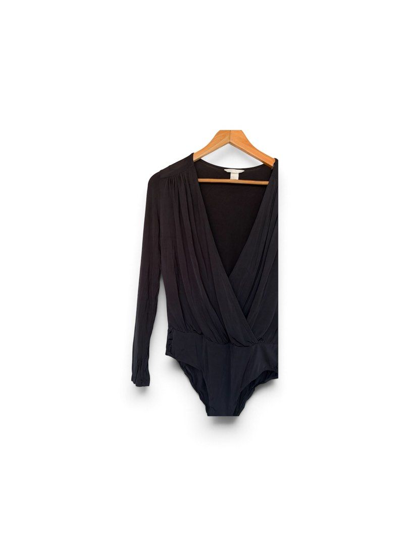 H&M Black Long sleeve Bodysuit (Category: Others Tops) located in Quezon City. Submitted by chrizcboutique (Listing ID 1469188659, Image 3). Description: H&M Black Longsleeve bodysuit medium in tag made in Cambodia stretchy material Measurements laid in flat shoulder to shoulder approx 16 inches armpit to armpit approx 19 inches waist approx 17inches Condition still in good condition lightly used no visible flaws please not that the first photo i