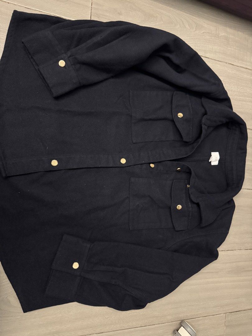 H&M Black Oversized Button-Up Jacket (Category: Coats, Jackets and Outerwear) located in Taguig. Submitted by sqaumejada (Listing ID 1469163442, Image 1). Description: - Brand: H&M - Color: Navy Blue - Size: XL - Details: Gold-tone hardware buttons on front, cuffs, and dual chest pockets - Style: Classic collar with structured back seams - Material: Thick, fleece-like textured fabric (warm for cooler days) - Condition: Clean and well maintained.