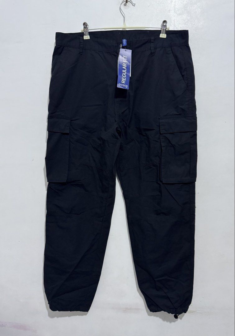 H&M Divided Regular Fit Cargo Pants Black Size 33/30 (Category: Jeans) located in Manila. Submitted by esparciake75752 (Listing ID 1469196550, Image 1). Description: - Brand: H&M Divided - Style: Cargo pants with multiple utility pockets - Color: Black - Fit: Regular fit with button closure and belt loops - Size: EUR 33/30, UK 33/30, CN 175/84A - Details: Adjustable drawstring cuffs at the bottom ankles - Condition: Brand new with original tags a