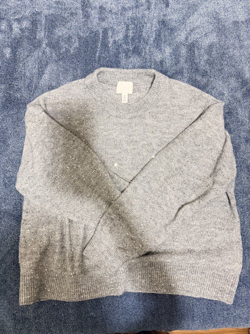 H&M Grey Sequined Knit Sweater (Category: Coats, Jackets and Outerwear) located in Cavite. Submitted by mgd.blessed (Listing ID 1469313979, Image 3). Description: - Brand: H&M - Color: Grey - Material: Warm knit fabric with subtle all-over sequins - Details: Crew neckline, ribbed collar, cuffs, and hem - Style: Cozy, great for layering, and adds a touch of sparkle to everyday wear or winter nights out Size S on tag but fits M-L.