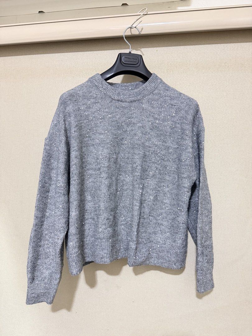 H&M Grey Sequined Knit Sweater (Category: Coats, Jackets and Outerwear) located in Cavite. Submitted by mgd.blessed (Listing ID 1469313979, Image 1). Description: - Brand: H&M - Color: Grey - Material: Warm knit fabric with subtle all-over sequins - Details: Crew neckline, ribbed collar, cuffs, and hem - Style: Cozy, great for layering, and adds a touch of sparkle to everyday wear or winter nights out Size S on tag but fits M-L.