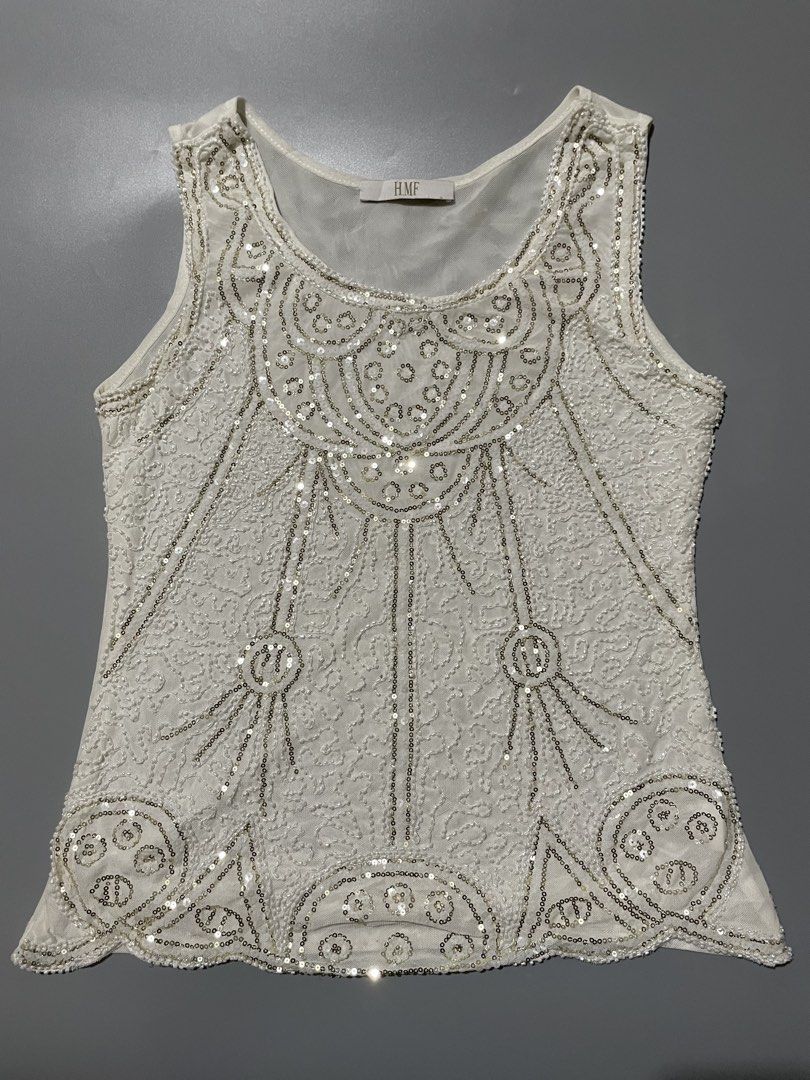 H.M.F Beaded Sequin Mesh Tank Top (Category: Sleeveless) located in Manila. Submitted by willowchie29 (Listing ID 1469302397, Image 1). Description: - Brand: H.M.F - Style: Sleeveless white mesh tank top with scoop neckline - Details: Covered in clear sequins and tiny beads with an intricate art deco swirl pattern all over the front - Condition: Delicate fabric with full embellishments - Perfect for: Parties, night outs, and special events.