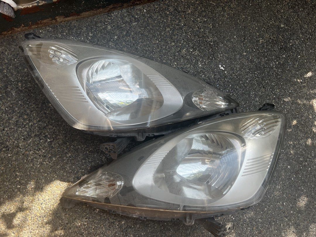 Honda Jazz GE Pre - MMC Headlight Assembly (Category: Lightings, Horns, and other Electrical Parts and Accessories) located in Quezon City. Submitted by digital_ryan (Listing ID 1469283738, Image 3). Description: For Sale: Used Honda Jazz GE Pre- MMC Headlight Assembly With FREE Novsight LED Bulb Complete Brackets issue: Sun Peeling but does not affect light .