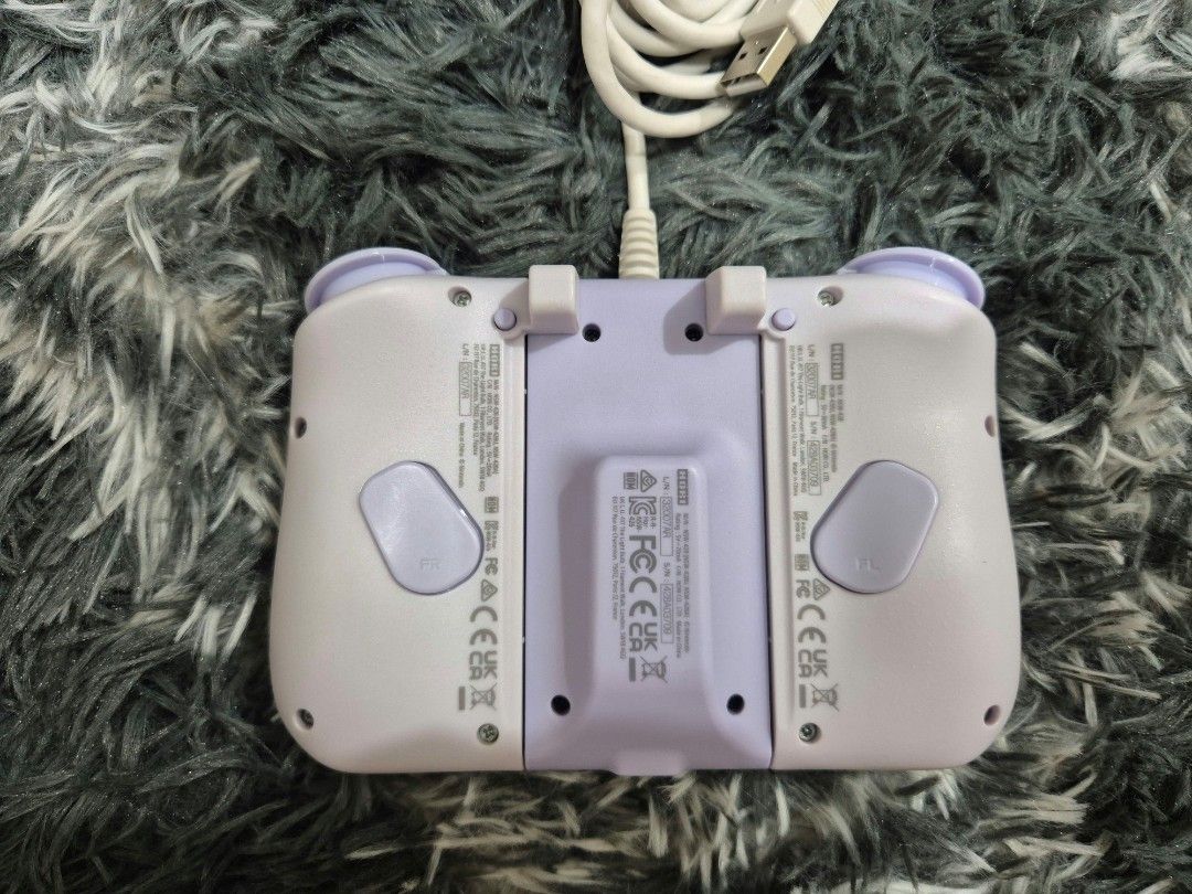 Hori Split Pad Fit (Category: Controllers) located in Makati City. Submitted by sharkdines (Listing ID 1469222368, Image 3). Description: Hori Split Pad for NSW Purple RFS: Decluttering Issue: a bit of yellowing (see pic).