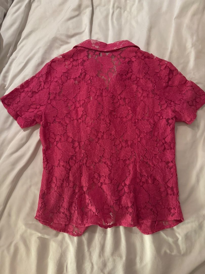 Hot Pink Lace Button-Up Shirt Small (Category: Blouses) located in Cebu City. Submitted by txproj27 (Listing ID 1469216391, Image 2). Description: - Color: Bright hot pink - Material: Lightweight sheer floral lace - Design: Short sleeves, classic collar, and white front buttons - Style: Chic button-up shirt perfect for layering - Condition: Great pre-loved condition (Tag intact).