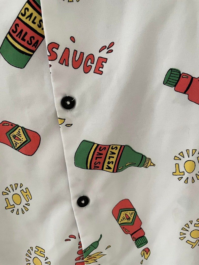 Hot Sauce Print Polo - M (Category: Tshirts & Polo Shirts ) located in Cainta. Submitted by pnedp2022 (Listing ID 1469211275, Image 3). Description: - Brand: Level Ten Design (from BKK) - Size: Medium - Condition 10/10 used once - Loc: Greenwoods Pasig/Cainta.