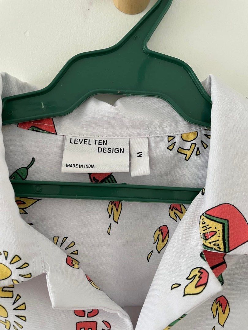 Hot Sauce Print Polo - M (Category: Tshirts & Polo Shirts ) located in Cainta. Submitted by pnedp2022 (Listing ID 1469211275, Image 2). Description: - Brand: Level Ten Design (from BKK) - Size: Medium - Condition 10/10 used once - Loc: Greenwoods Pasig/Cainta.