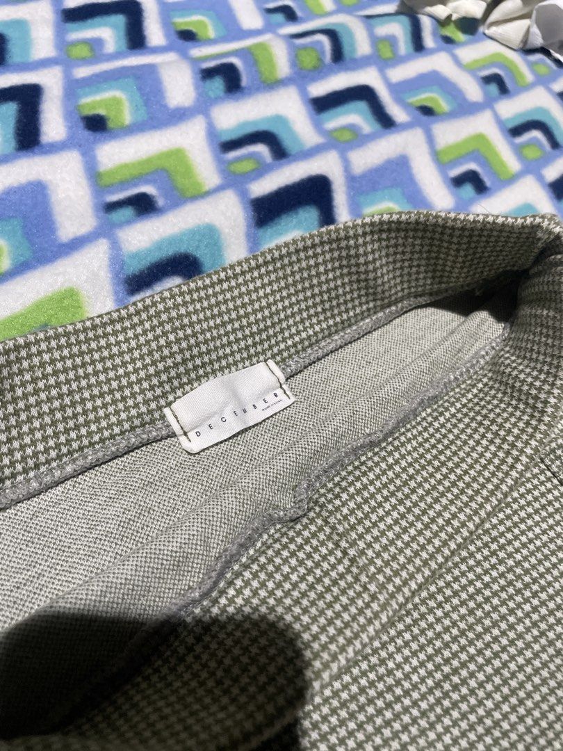 Houndstooth Knit Mini Skirt (Category: Skirts) located in Manila. Submitted by sapsari (Listing ID 1469302007, Image 3). Description: - Style: Green and white houndstooth knit mini skirt - Brand/Origin: December, Made in Korea - Features: elastic waistband and functional front pockets - Material: Soft, stretchy, and comfortable fit Color: greenish.