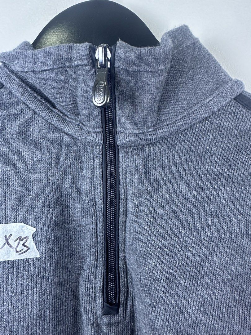 Hugo Boss Grey Quarter Zip Sweater (Category: Coats, Jackets and Outerwear) located in Manila. Submitted by declutterpromax (Listing ID 1469215650, Image 2). Description: - Brand: Boss - Color: Grey - Style: Quarter-zip sweater with high mock neck - Details: Ribbed knit texture all over, black Boss logo zipper pull, metal logo tag near hem, and dark shoulder piping - Pit-to-Pit: 21 inches - Length: 24 inches - Sleeve Length: 23 inches - Condition