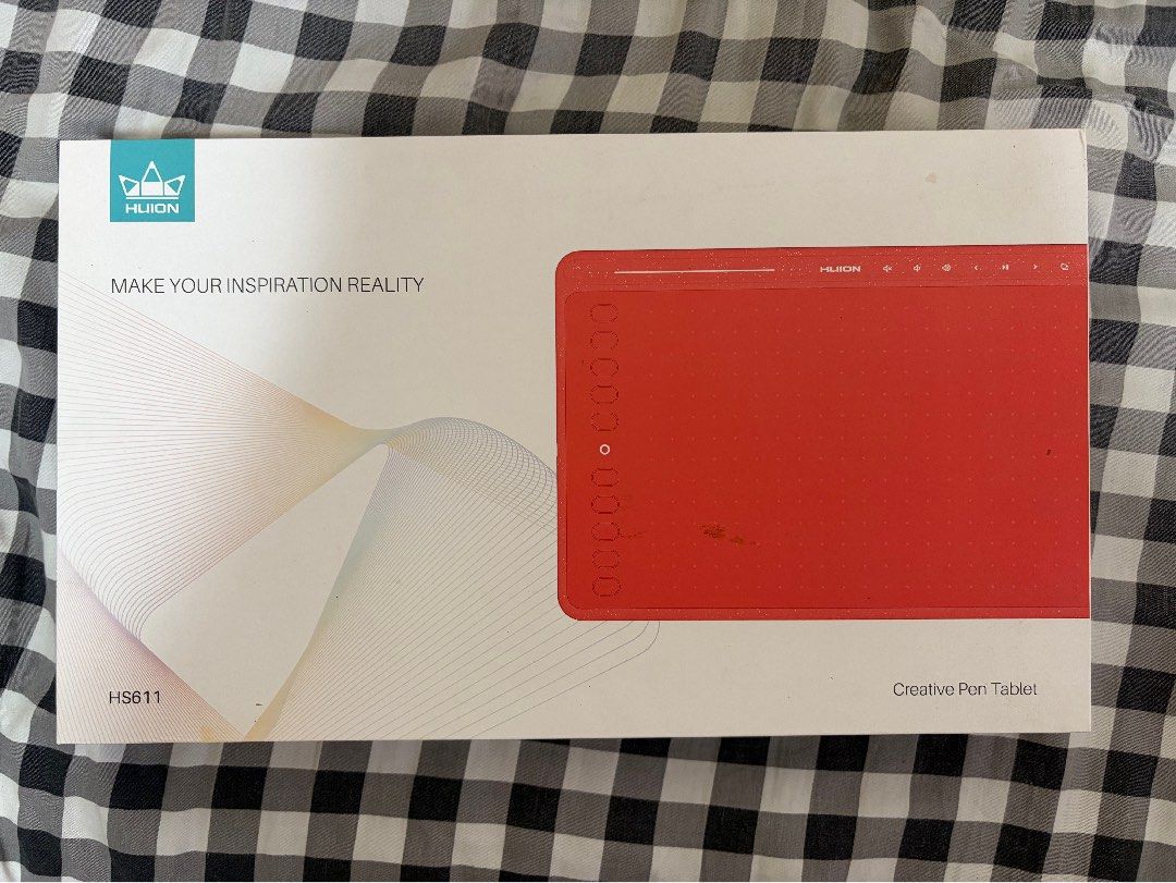 Huion Creative Pen Tablet (Category: Other Accessories) located in Muntinlupa City. Submitted by mightybaguetti (Listing ID 1469255431, Image 1). Description: Well used huion drawing tablet in grey colorway, still works, however pen holder and extra nibs are missing.