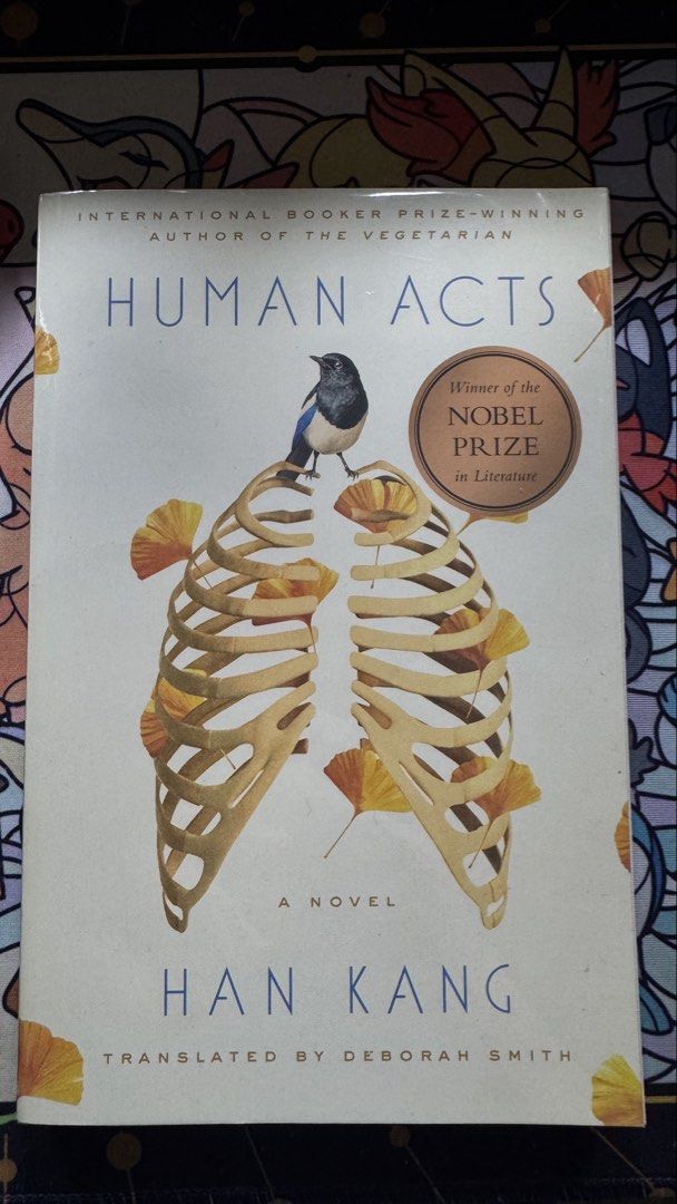 Human Acts by Han Kang Novel Paperback (Category: Storybooks) located in Quezon City. Submitted by cc.lumberio (Listing ID 1469183813, Image 1). Description: - Title: Human Acts by Han Kang - Translation: English by Deborah Smith - Edition: Nobel Prize winner edition with front cover bronze sticker - Genre: Gwangju Uprising historical fiction paperback - Cover Art: Clean design featuring a bird and skeleton illustration.