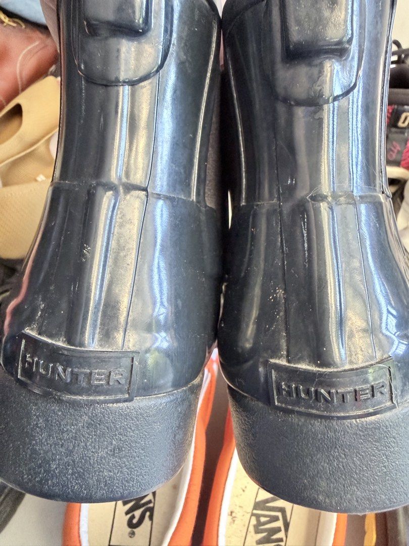 Hunter boots (Category: Boots) located in Pasig City. Submitted by shellbyf (Listing ID 1469163421, Image 1). Description: Hunter boots Bought and stored only Issue: It has a tear on both due to storage but it will not affect the usage as the boots is garterized.