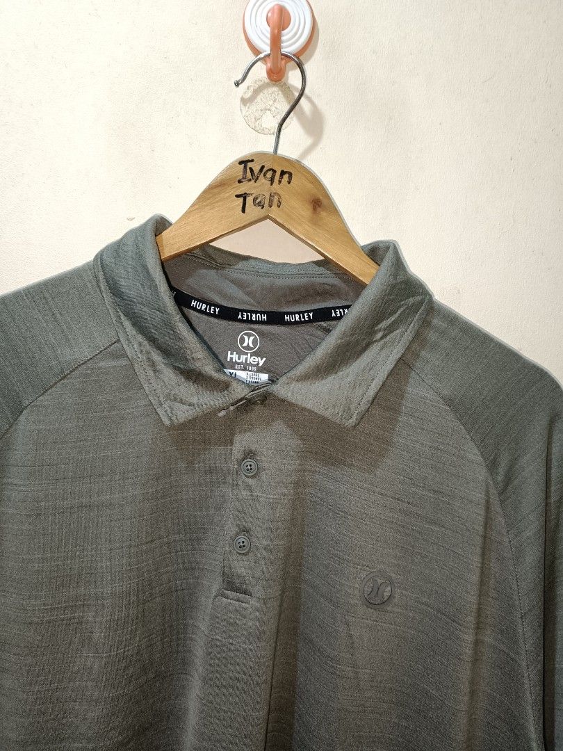 Hurley Poloshirt (Category: Tshirts & Polo Shirts ) located in Makati City. Submitted by ivsseyow03 (Listing ID 1469278957, Image 2). Description: Hurley polo shirt in green marled fabric. Size XL. Made from 88 percent polyester and 12 percent elastane. Short sleeves, classic collar neckline with a three-button placket. Small Hurley logo printed on the left chest. Interior neck tape branding. Extra replacement button included on the inner tag..