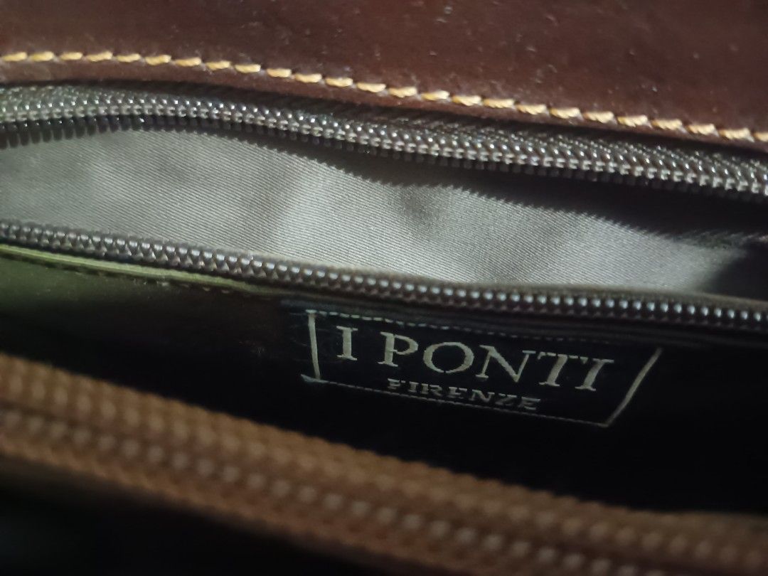 I Ponti Firenze Brown Leather Shoulder Bag (Category: Luxury Bags & Wallets) located in Quezon City. Submitted by cxthsells (Listing ID 1469255209, Image 2). Description: - Authentic I Ponti Firenze leather bag directly from Florence - Premium genuine leather with a rich dark brown shade and stylish contrast stitching - Versatile design featuring a built-in top handle and an adjustable shoulder strap - Well-organized interior with branded fabric 