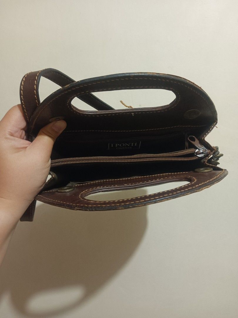 I Ponti Firenze Brown Leather Shoulder Bag (Category: Luxury Bags & Wallets) located in Quezon City. Submitted by cxthsells (Listing ID 1469255209, Image 3). Description: - Authentic I Ponti Firenze leather bag directly from Florence - Premium genuine leather with a rich dark brown shade and stylish contrast stitching - Versatile design featuring a built-in top handle and an adjustable shoulder strap - Well-organized interior with branded fabric 