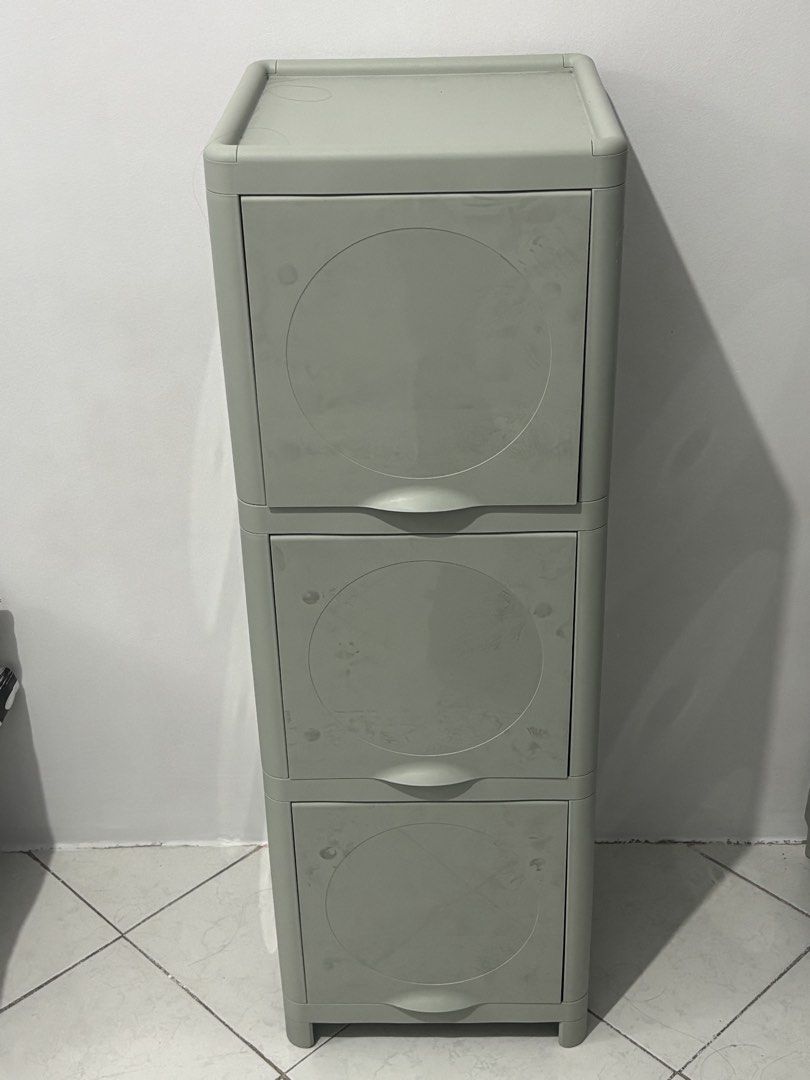 Ikea 3-Tier Plastic Storage Drawer Cabinet (Category: Shelves, Cabinets & Racks) located in Manila. Submitted by safefire.ae92b7 (Listing ID 1469356804, Image 2). Description: - Color/Design: Greenish-grey plastic storage tower with 3 pull-out drawers and a chic circular recessed pattern - Dimensions: 99 cm (H) x 33 cm (W) x 34 cm (D) - Condition: Good and sturdy, - Perfect space-saver for any room in the house.