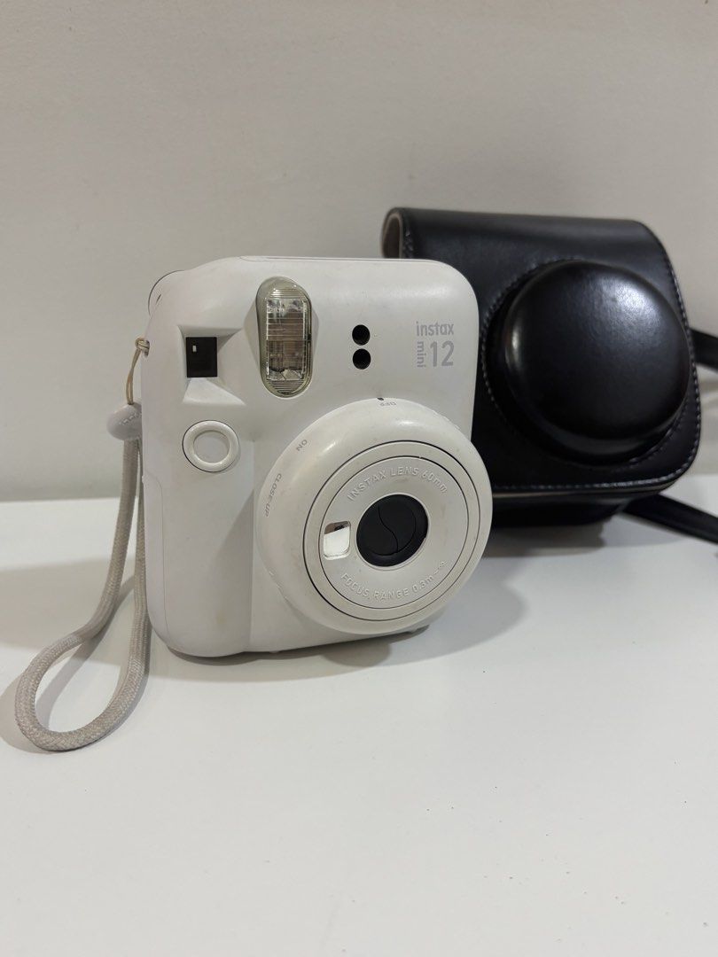 Instax Mini 12 with Free Case Bag (Category: Cameras) located in Manila. Submitted by shinyasu (Listing ID 1469257734, Image 1). Description: Instax Mini 12 with Free Case Bag No issues, just discoloration bec naluma na and exposure sa air but functioning very well pa. These are actual pictures, manage your expectations. RFS: i bought a new camera can nego if kunin agad ty!.