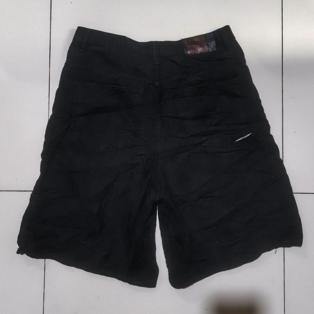 Ione Denim Shorts Black (Category: Shorts) located in San Carlos City. Submitted by dhong_abay_thrift (Listing ID 1469201130, Image 1). Description: - Brand: Ione - Color/Wash: Black denim, dark wash - Closure: Standard button fly - Fit: Straight cut - Details: Back patch pockets with branded logo patch and waistband label - Style: Versatile everyday streetwear essential - Condition: Excellent / Ready to ship 30-32 waist x 23L x 13.5 hem.