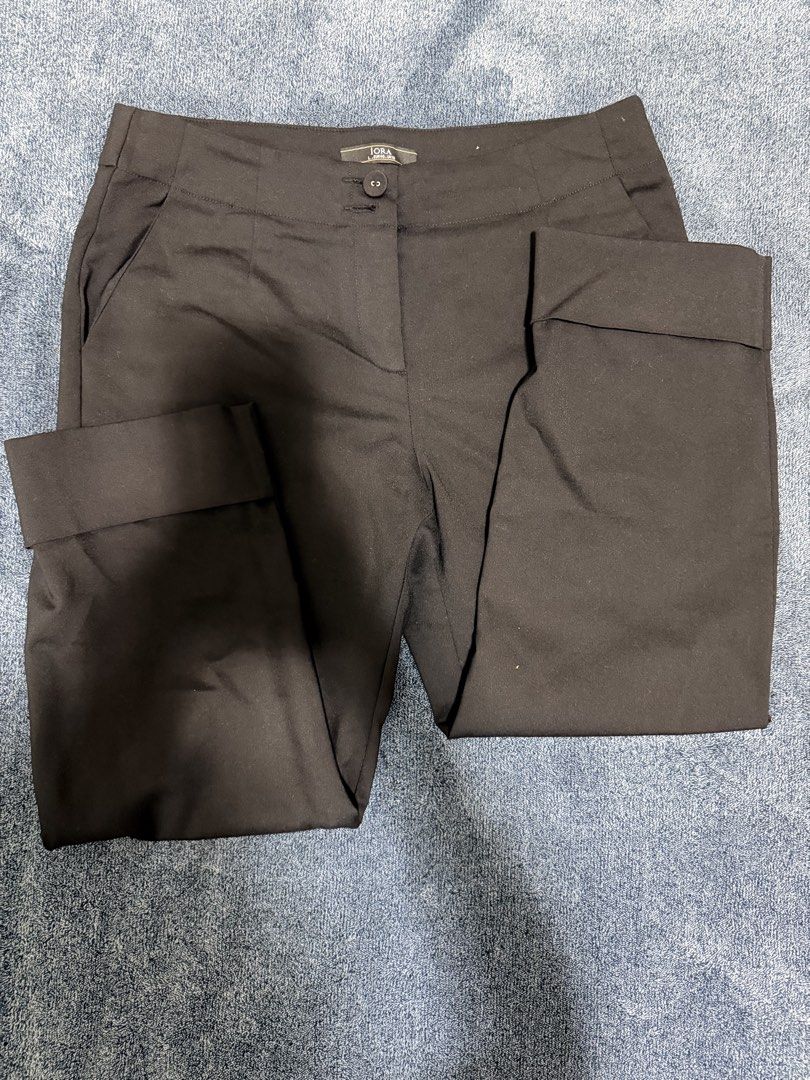Iora Black Cuffed Trousers Pants Size L (Category: Other Bottoms) located in Cavite. Submitted by mgd.blessed (Listing ID 1469309104, Image 2). Description: - Brand: Iora, bought in SG - Size: L (Waist: approx. 16 inches flat across) - Color: Black - Material: Smooth and lightweight fabric - Features: Trendy cuffed hems, front button closure with zip fly, and functional side pockets.