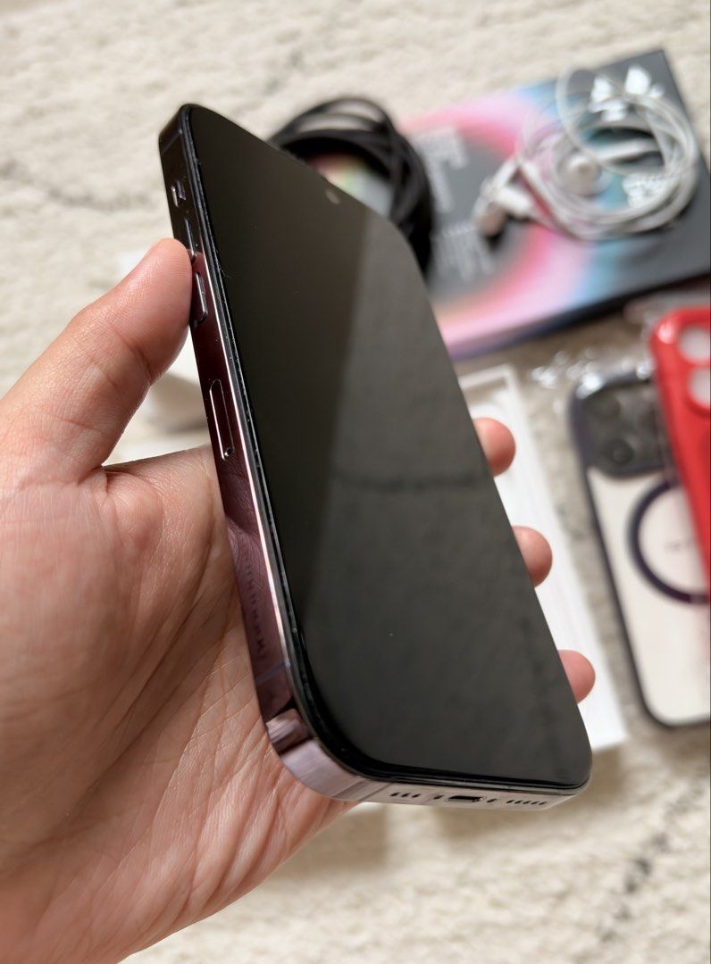 iPhone 14 PRO Factory unlocked 256GB (Category: iPhone 14 Series) located in Caloocan City. Submitted by justpeachie (Listing ID 1469199774, Image 2). Description: Iphone 14 PRO 256GB Deep purple Factory unlocked - pwede kahit anong sim/esim With original box With charger and headphones With privacy tempered glass & cases Palit na ang screen but still OLED, no problem sa paggamit With face id No iCloud problem Mahaba pa ang battery life Negotiabl