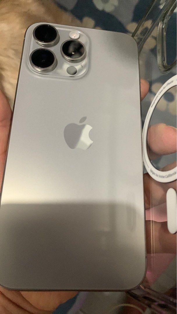 iPhone 15 Pro Max (Category: iPhone 15 Series) located in Pasig City. Submitted by ayubzkee (Listing ID 1469388324, Image 2). Description: - Model: iPhone 15 Pro Max - Storage: 256GB - Color: Natural Titanium battery health at 85% No sim restrictions & purchased via Smart With original box same IMEI, no charger cable - Condition: Pristine, flawless, no issues at all - Usage: Never abused, never used for gaming - Protection: Fitted with Spigen tem