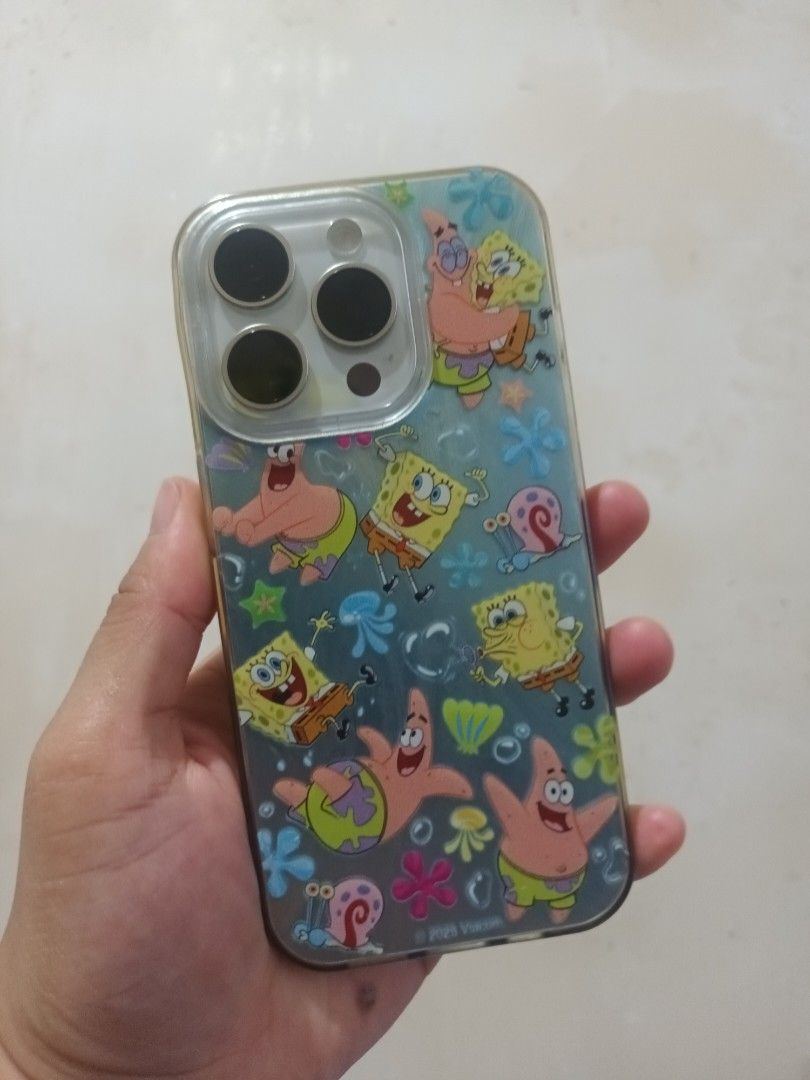 iPhone 15Pro (Category: iPhone 15 Series) located in Manila. Submitted by hunters15 (Listing ID 1469240687, Image 2). Description: - Model: iPhone 15 Pro - Storage: 128GB - Color: White Titanium (comes with a cute Spongebob case as seen in photos) - Battery Health: 86% - Status: Openline (ready for any network) - Purchase Date: July 2024 - Service History: Genuine display replaced under warranty by Mobile Care PH (authorized service center) in Au