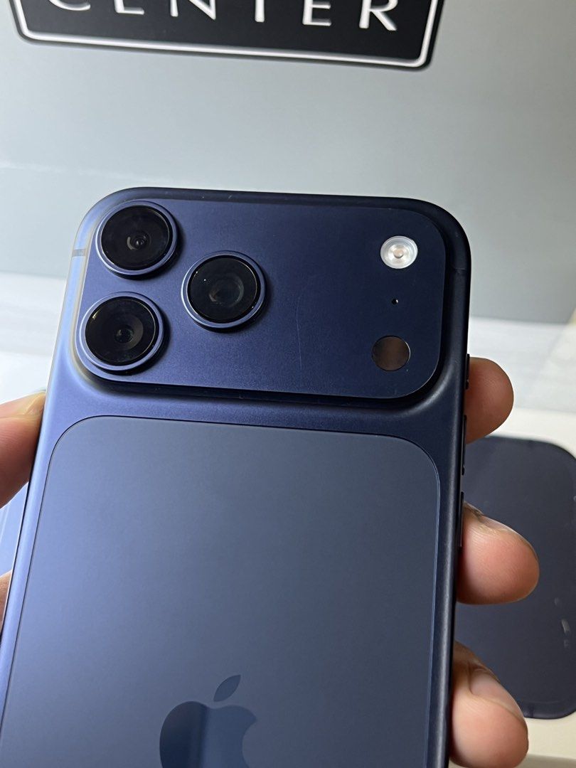 Iphone 17 Pro Max Deep Blue (Category: iPhone 17 Series) located in Calamba. Submitted by jkafrica10 (Listing ID 1469314916, Image 3). Description: 1 year old, under warranty pa from powermac Complete (paper bag, box, lightning cable) 2 small hairline sa plateau.