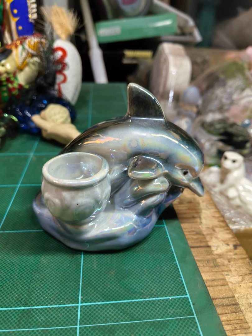 Iridescent Dolphin Figurine / Pen Holder (Category: Other Home Decor) located in Cebu City. Submitted by dudes_villanueva (Listing ID 1469272565, Image 2). Description: Iridescent Dolphin Figurine / Pen Holder Material: Glazed Ceramic In excellent condition.